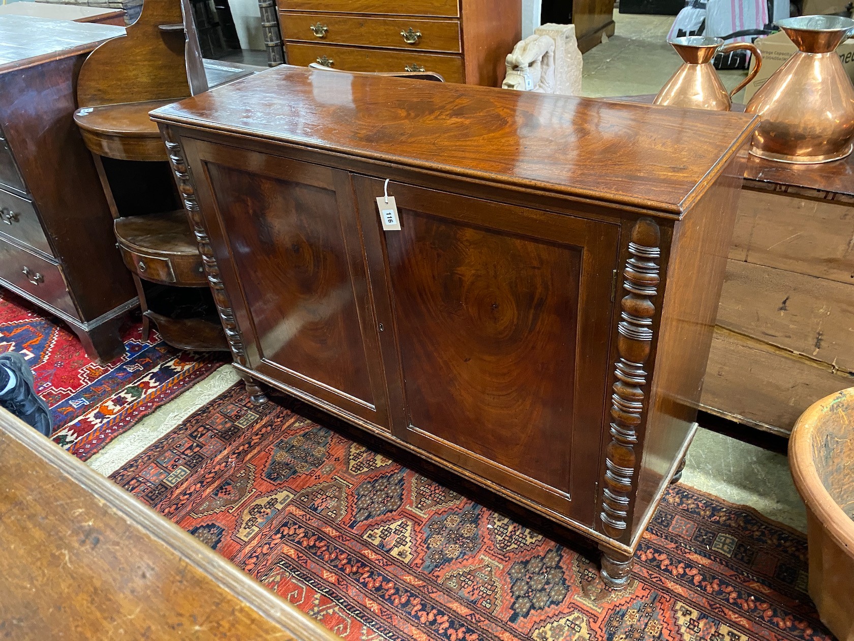 An early VIctorian mahogany two door side cabinet, width 124cm, depth 44cm, height 92cm